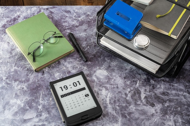A calendar with important dates circled, emphasizing deadlines for submitting paperwork. A calculator and a pen are placed next to the calendar, suggesting careful planning.