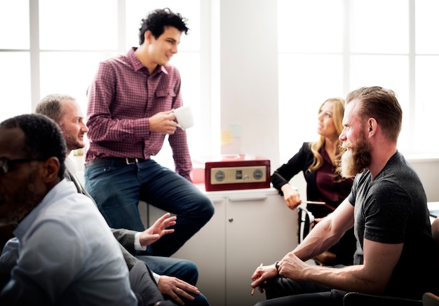 A business professional participating in a workshop, actively engaging with the speaker and other participants, illustrating the value of interactive learning experiences.