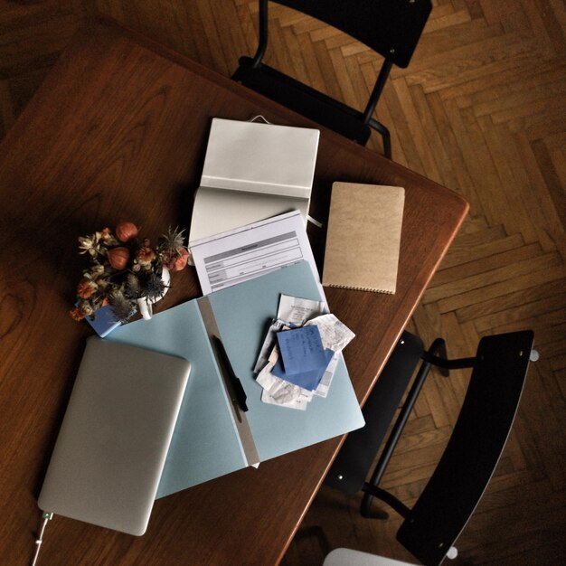 A photograph of various legal documents, including wills and trusts, spread out on a desk. A pen is resting on one of the documents, symbolizing the process of reviewing and updating estate planning documents.