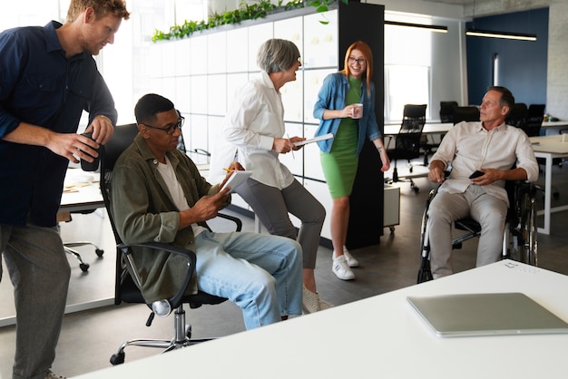 A diverse group of professionals collaborating in a modern office setting, representing the career opportunities unlocked by an online degree. The scene conveys a sense of success and professional growth.