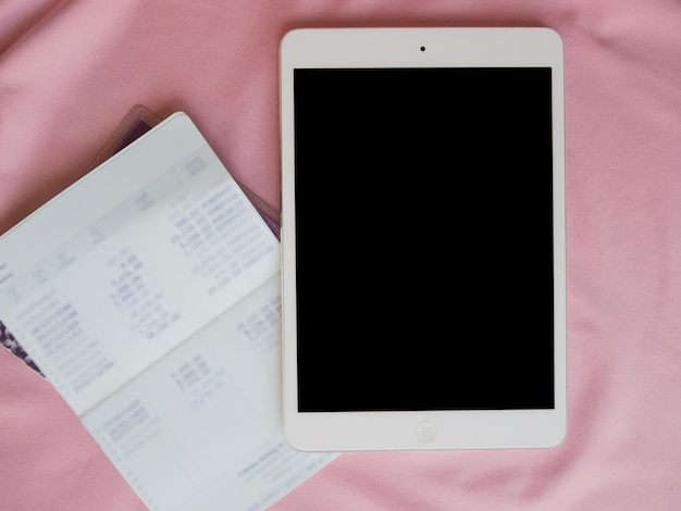 A planner or digital calendar app displayed on a tablet, showing a week's schedule filled with classes, study sessions, and social activities. Each entry is color-coded to represent different categories, visually demonstrating effective time management.