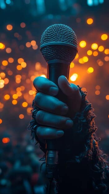 A close-up of IU singing on stage with a microphone in hand, bathed in soft, warm lighting. The focus is on her expressive face as she delivers the heartfelt lyrics of